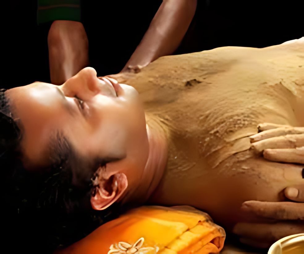 Herbal paste massage during Udvartana